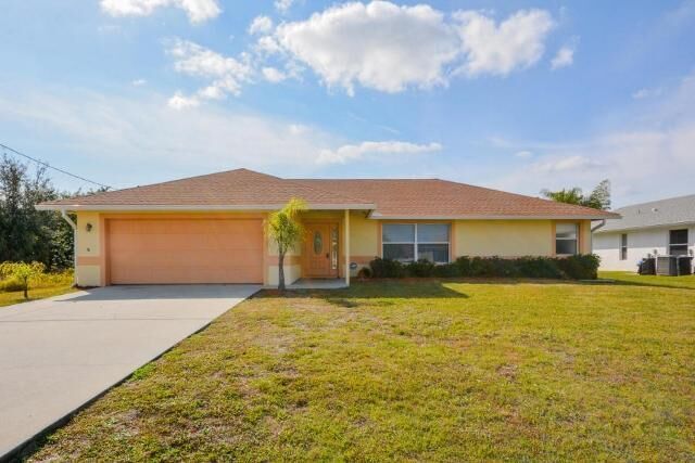 Property Photo: 4034 SW Jaqust Street FL 34953