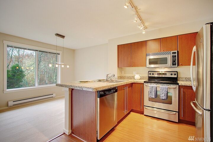 Property Photo:  11313 NE 128th Street E202  WA 98034 