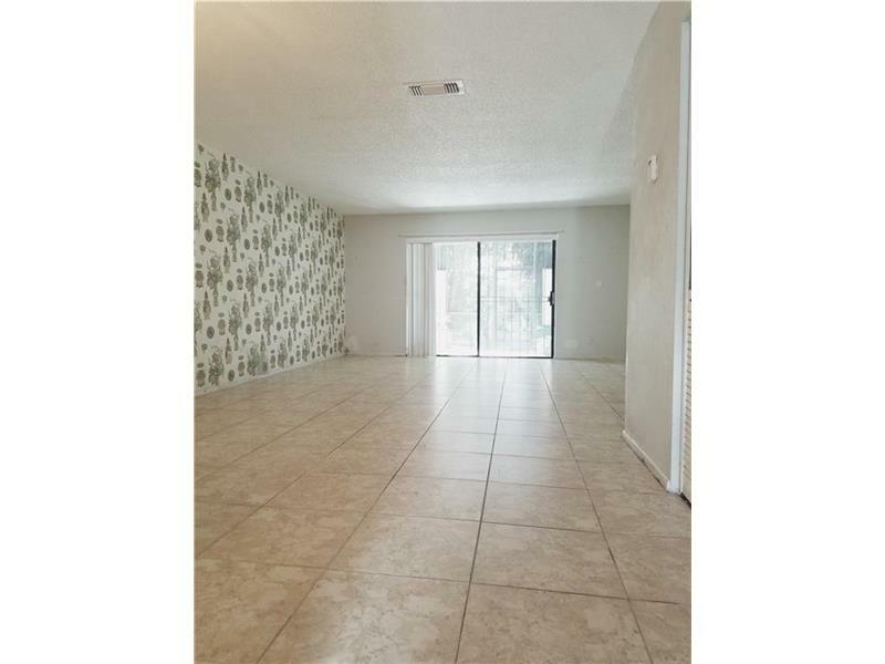 Property Photo:  9920 NW 13th Ct 52  FL 33024 