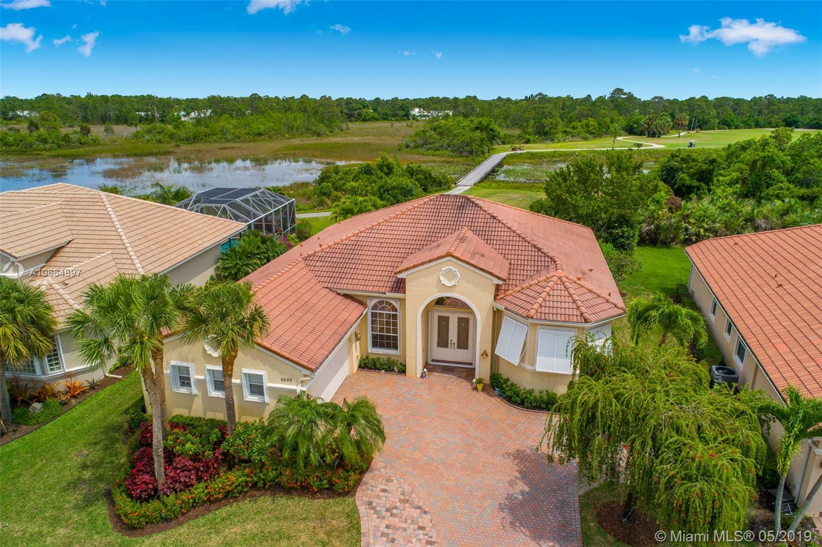 Property Photo:  6899 SE Sleepy Hollow Ln  FL 34997 