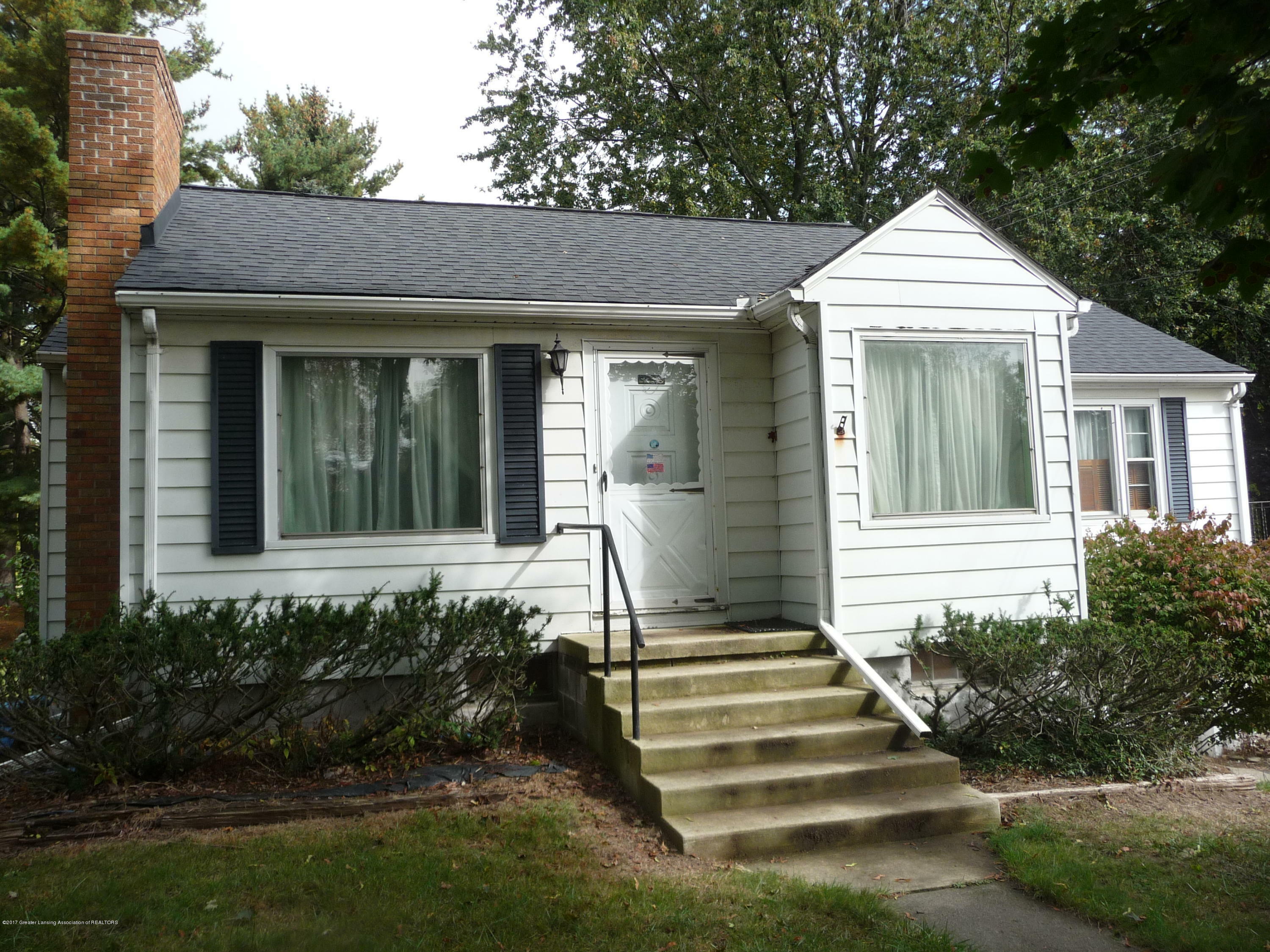 Property Photo:  1734 W Holmes Road  MI 48910 