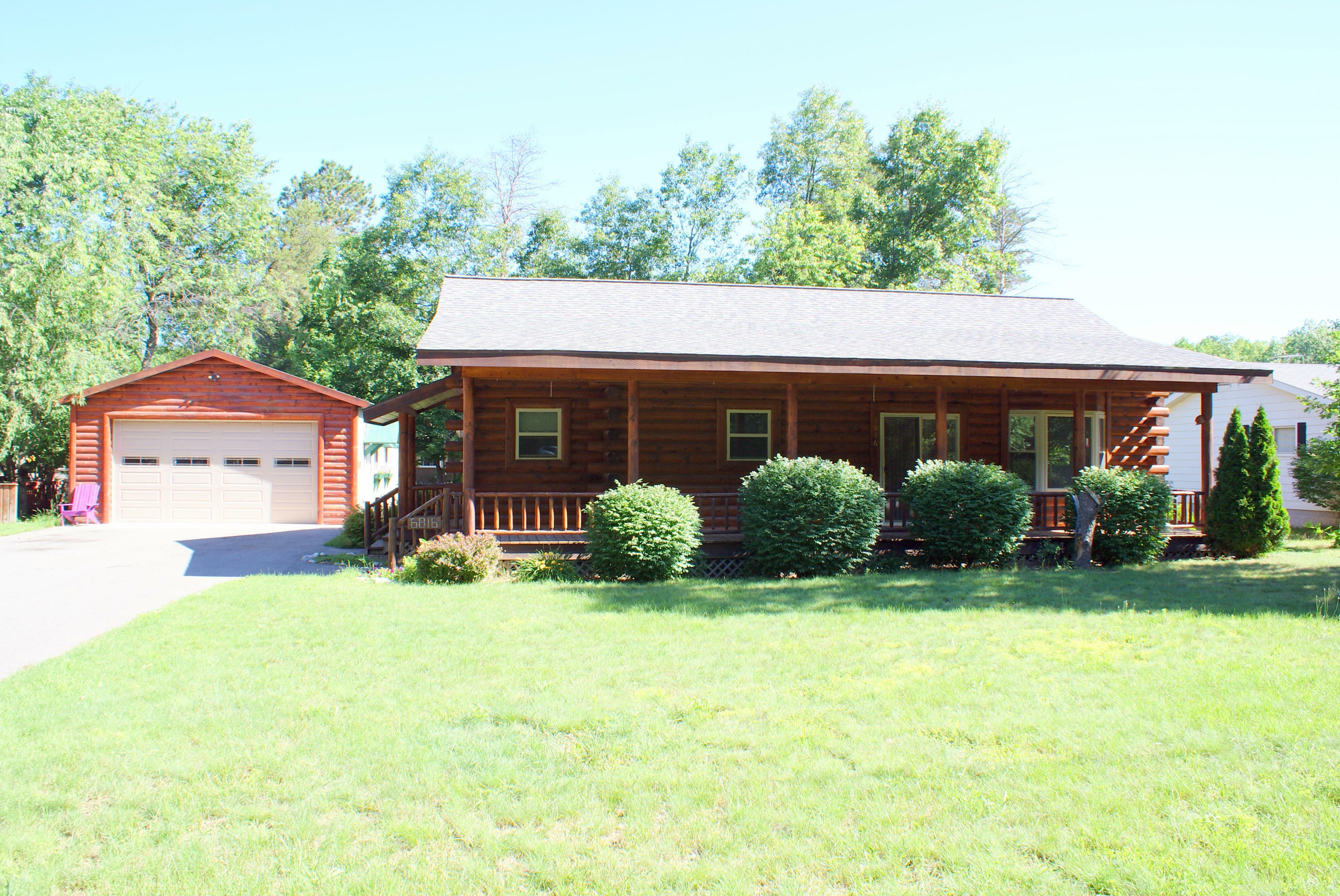 Property Photo:  6816 Fisherwoods Road  MI 49749 