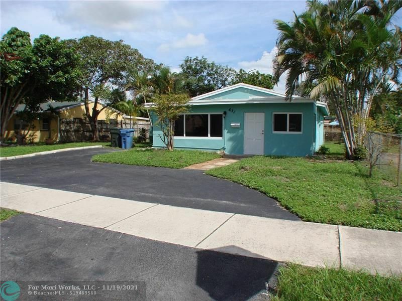 Property Photo:  631 NE 56th St  FL 33334 