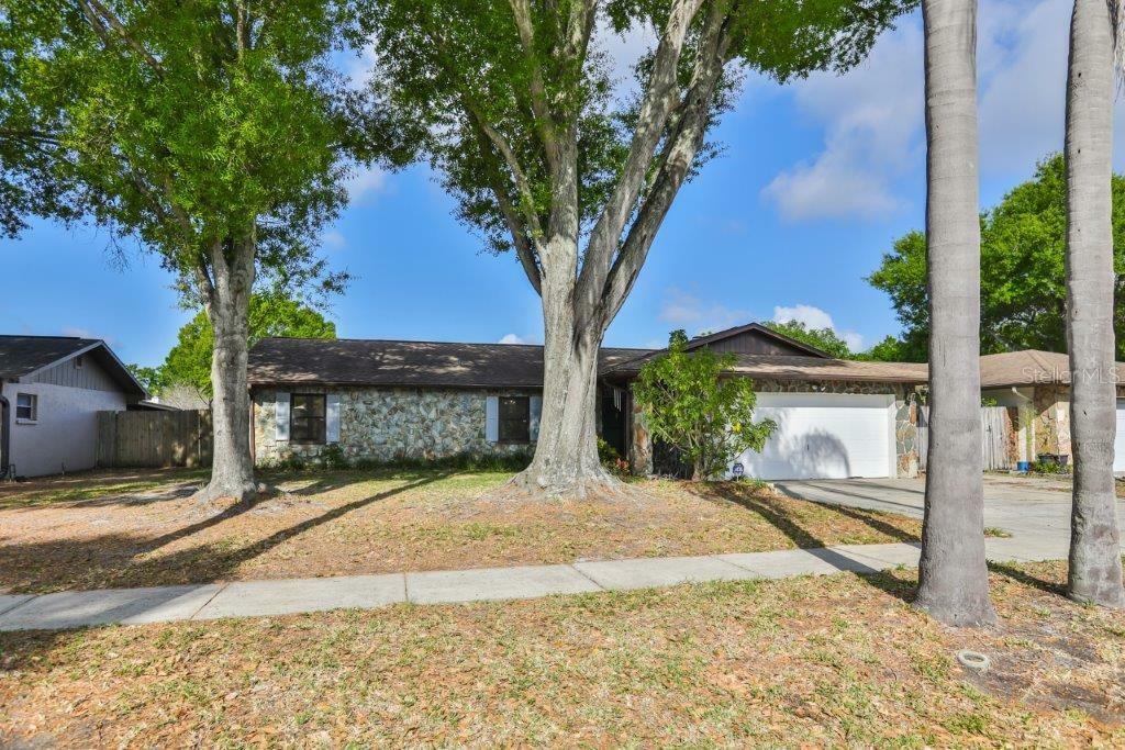 Property Photo:  7910 Singing Court Place  FL 33615 