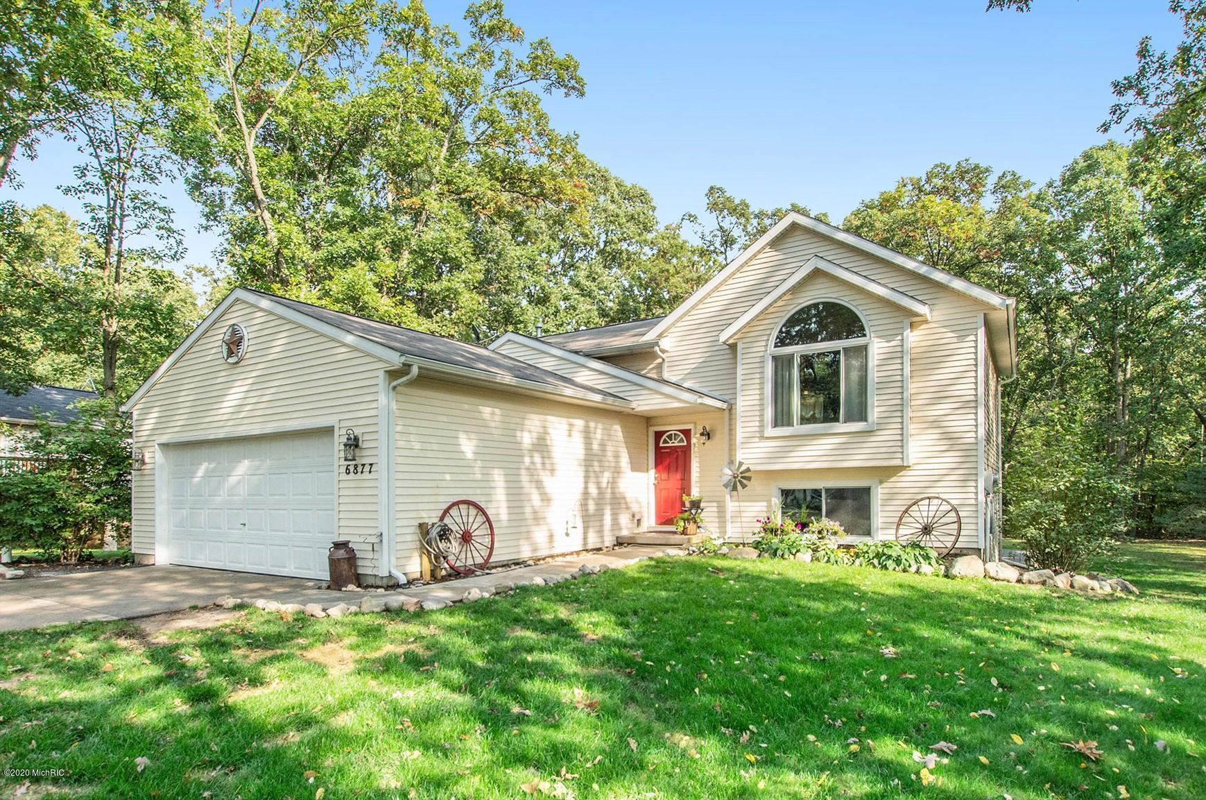 Property Photo: 6877 Whispering Forest Drive NE MI 49319