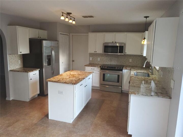 Property Photo:  471 Cardinal Court  FL 34759