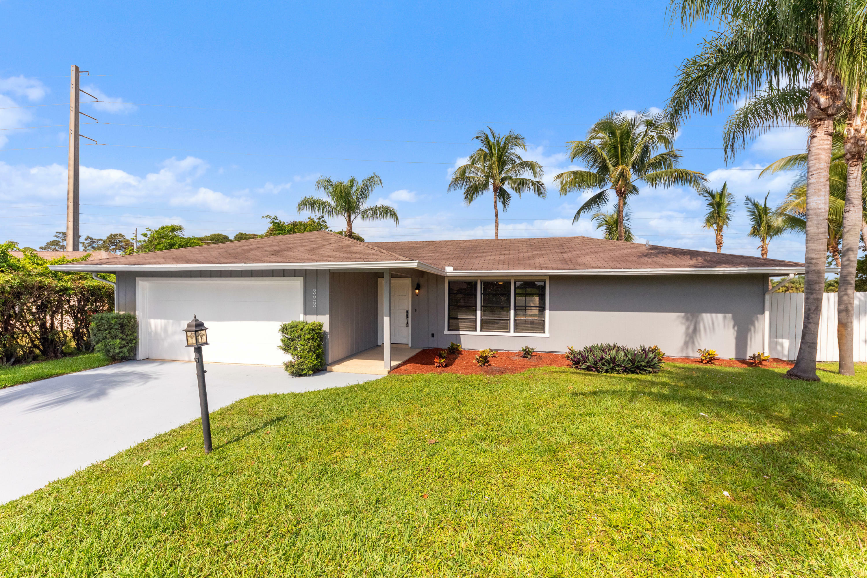 Property Photo: 323 Canterbury Drive W FL 33407