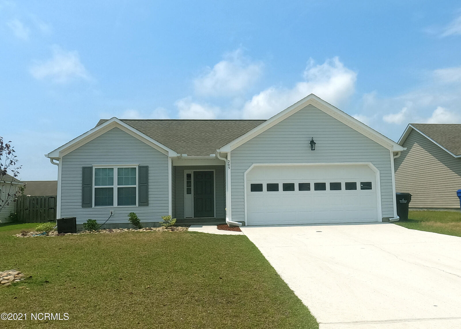 Property Photo:  205 Red Carnation Drive  NC 28445 