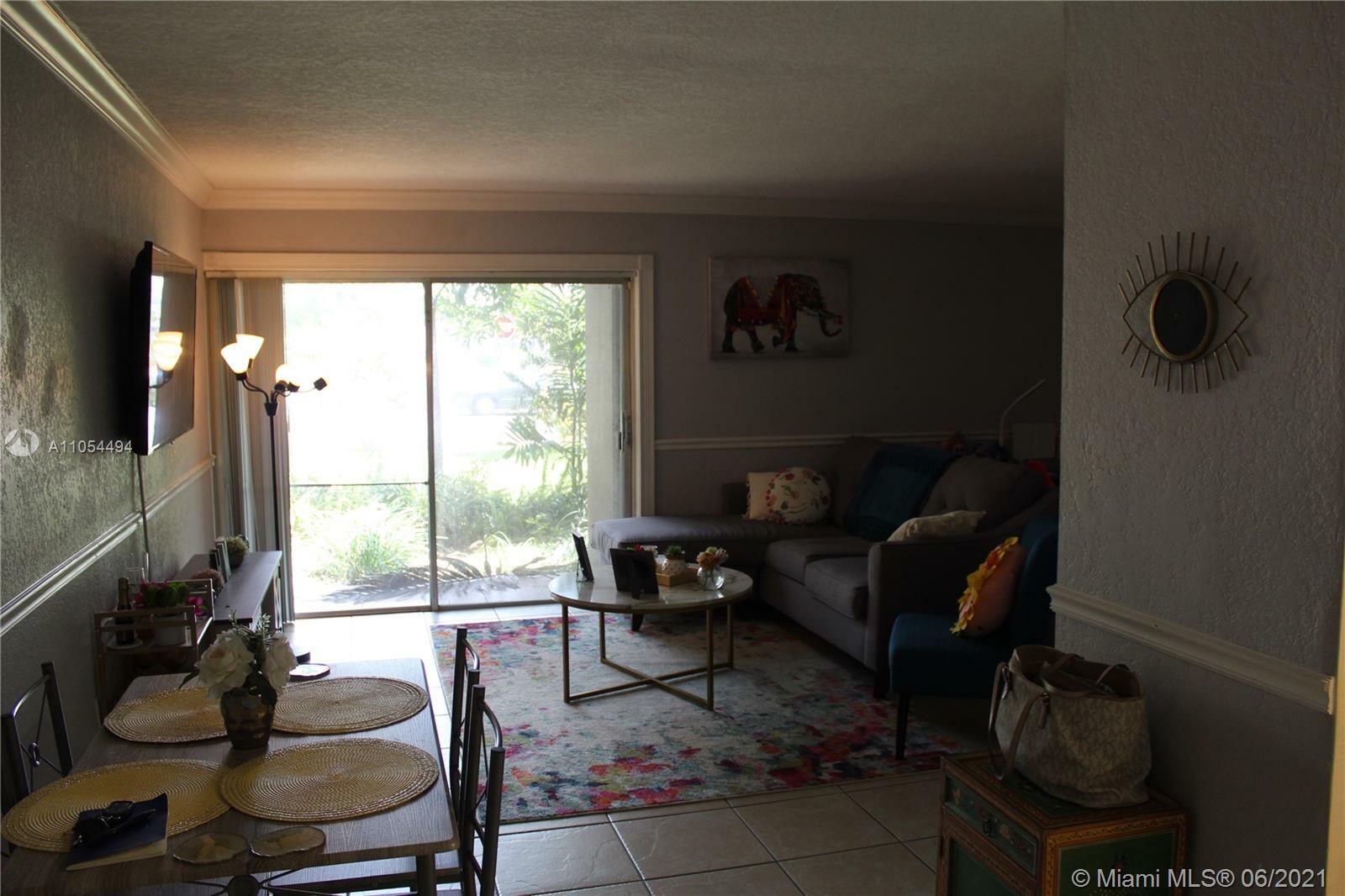 Property Photo:  9477 SW 76 03  FL 33175 