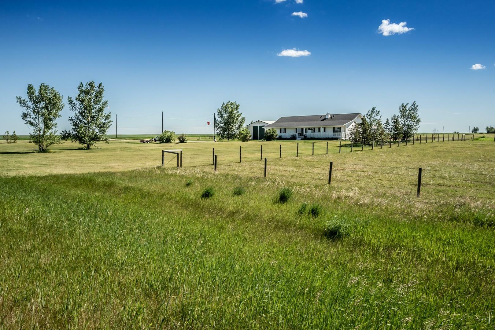 Property Photo: 256011 338 Avenue E AB T1S 1B5