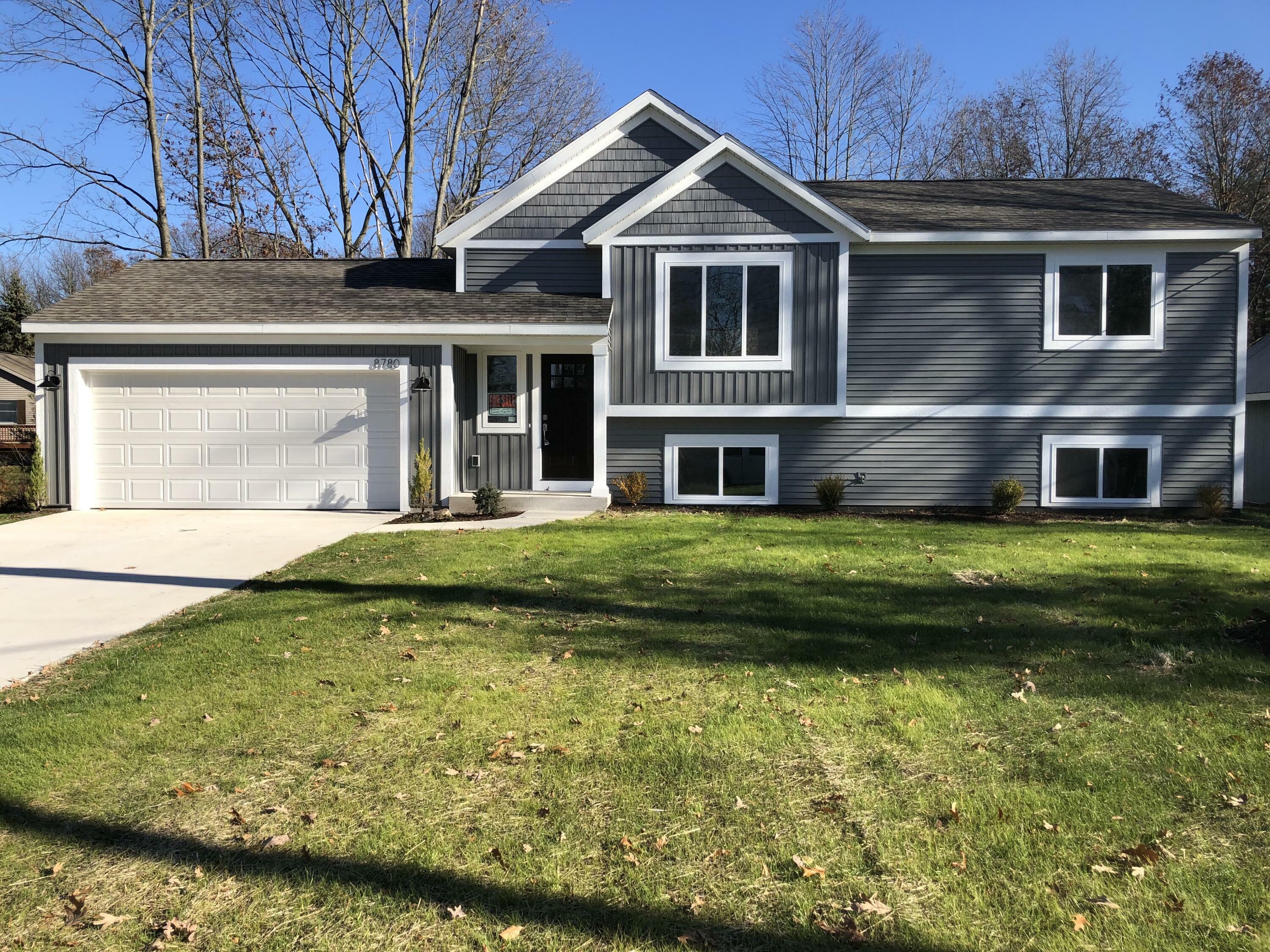 Property Photo:  8780 Huron Drive  MI 49329 