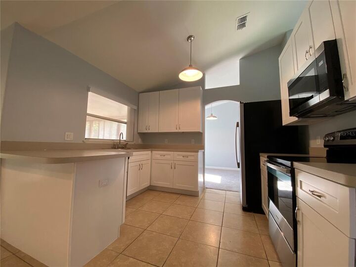 Property Photo:  13013 Sunwood Court  FL 34711 