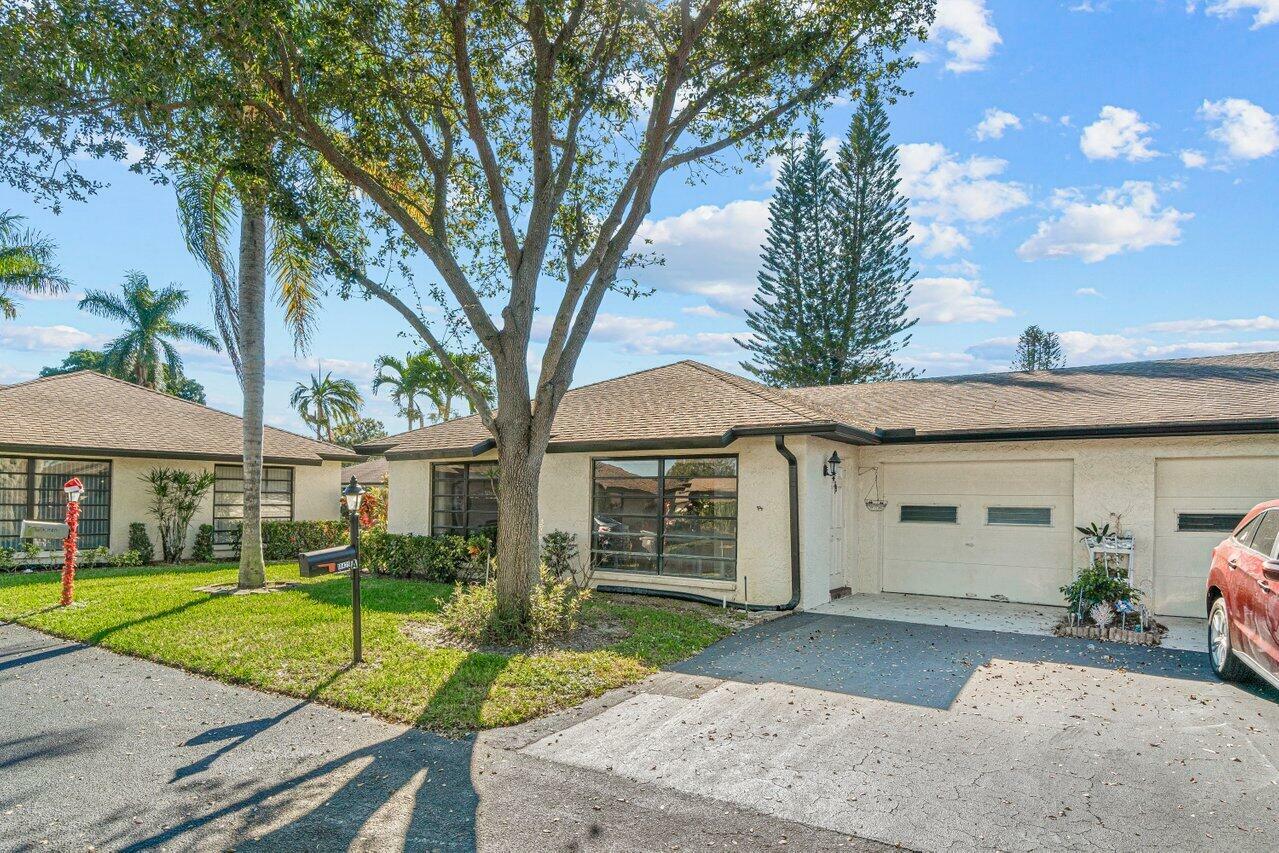 Property Photo:  10429 Quailwood Lane A  FL 33436 