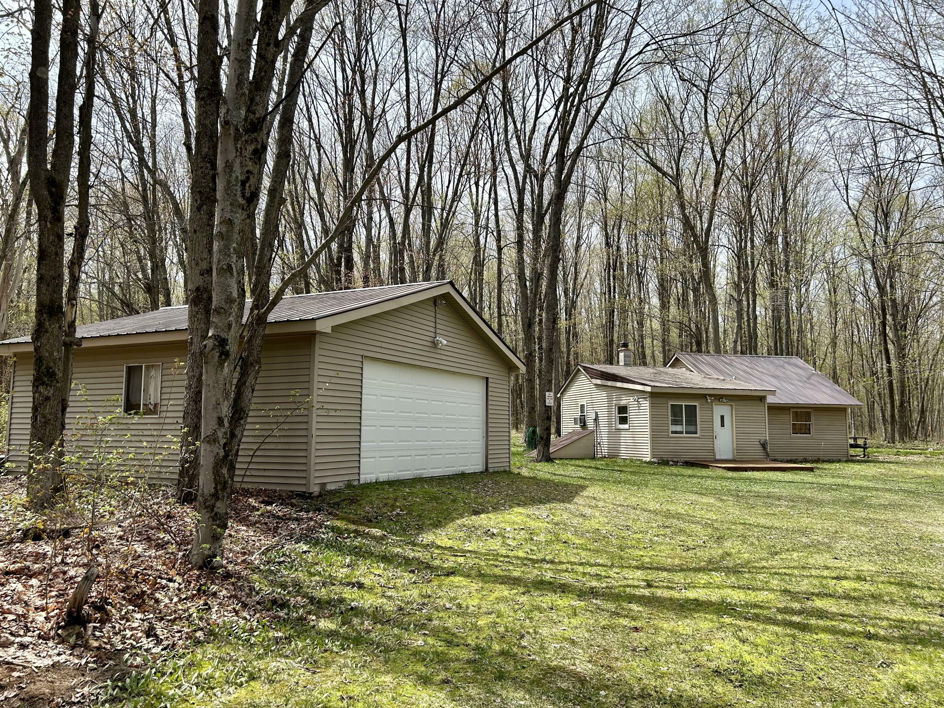 Property Photo:  6218 Whitehouse Trail  MI 49795 