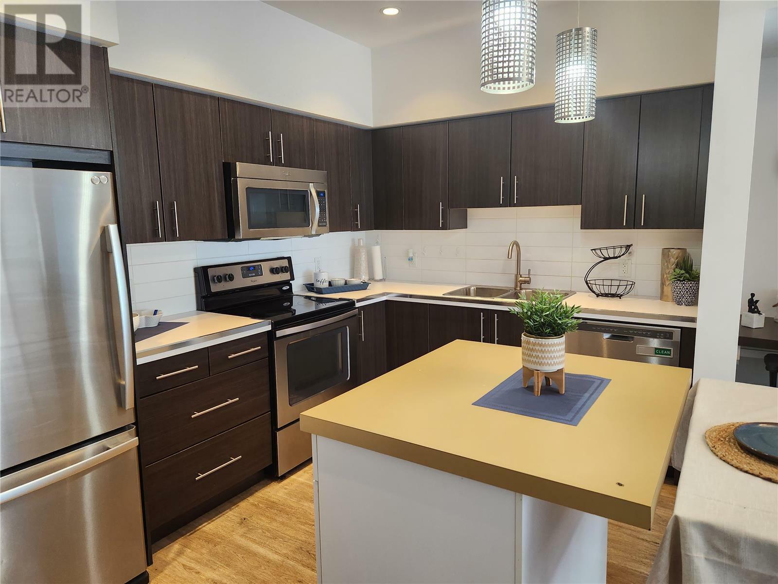 Property Photo: 975 Academy Way 209 BC V1V3C8