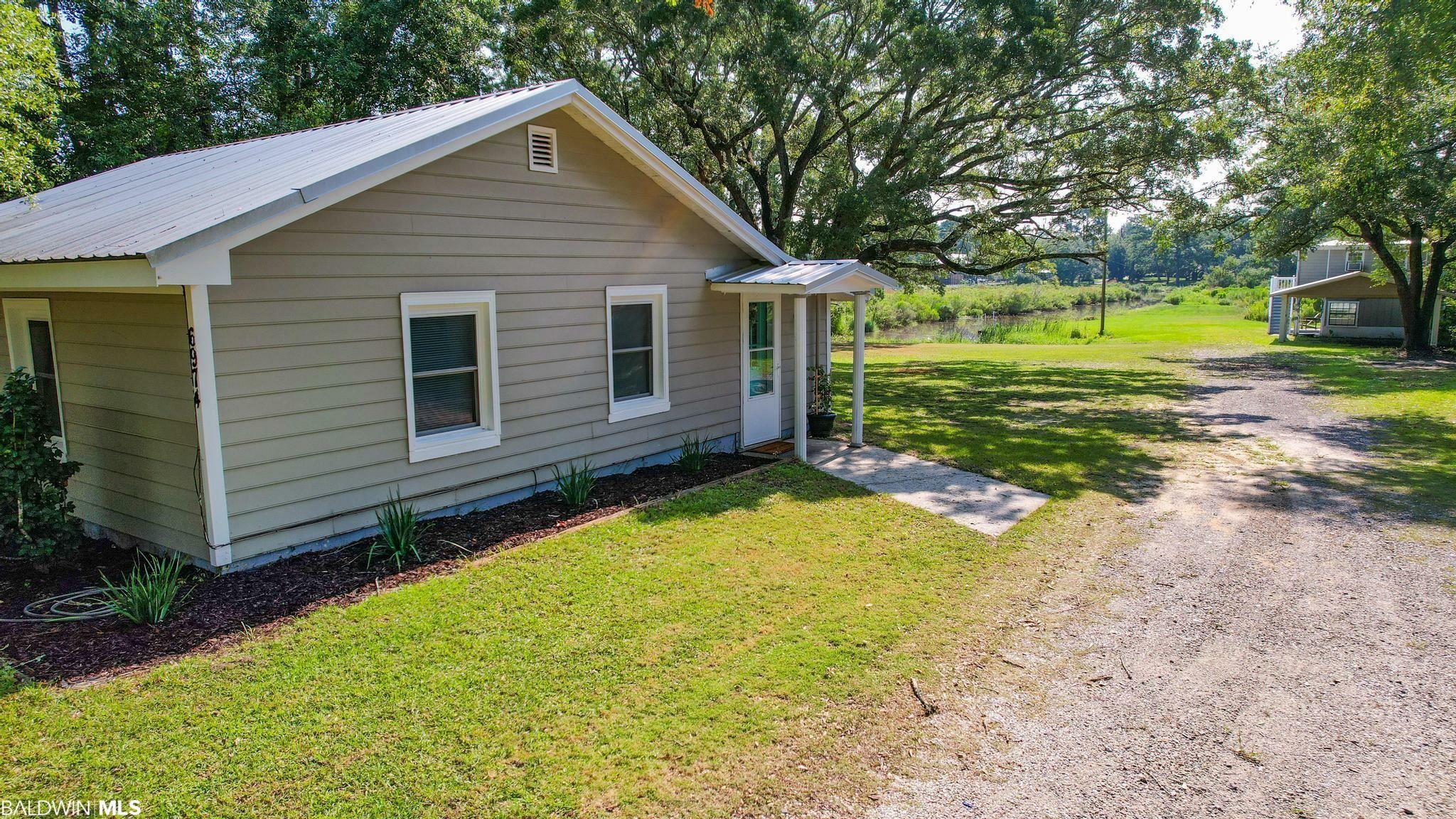 Property Photo:  6974 Piney Woods Road  AL 36535 