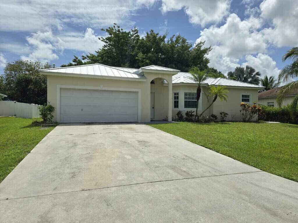 Property Photo:  1933 SE Cheltenham Street  FL 34983 