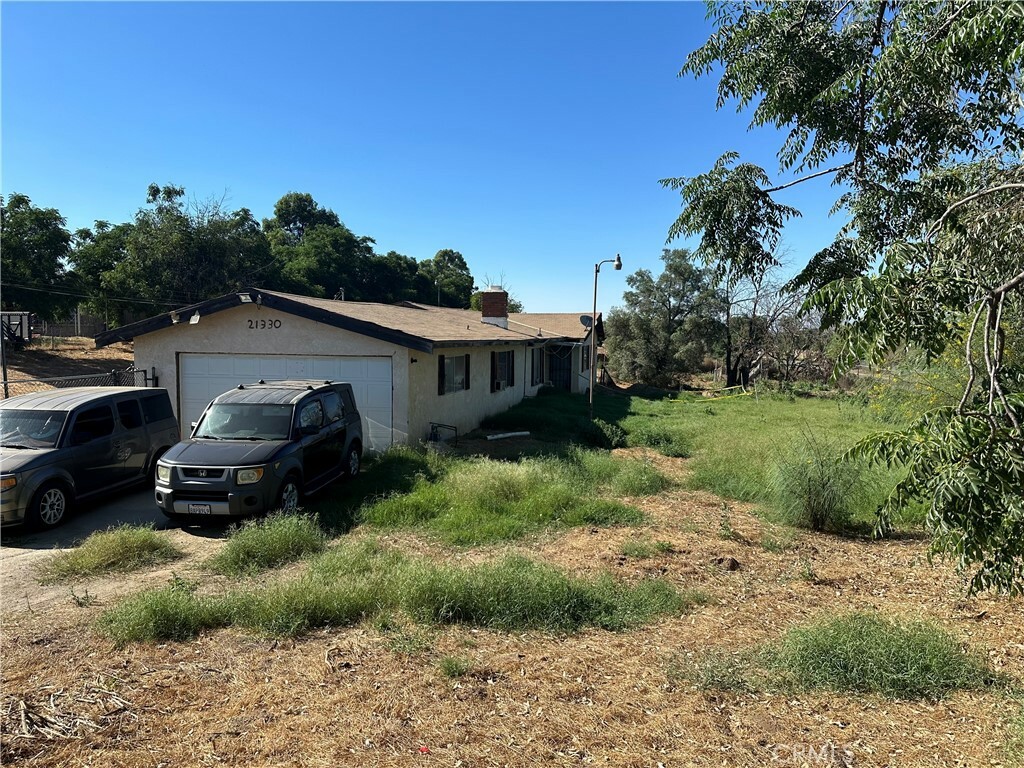 Property Photo:  21330 Orange Avenue  CA 92570 