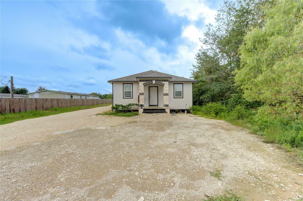 Property Photo: 884 County Road 3550 TX 77327