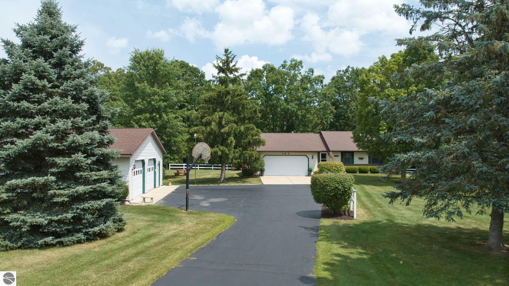 Property Photo:  465 Bluegrass Road  MI 48858 