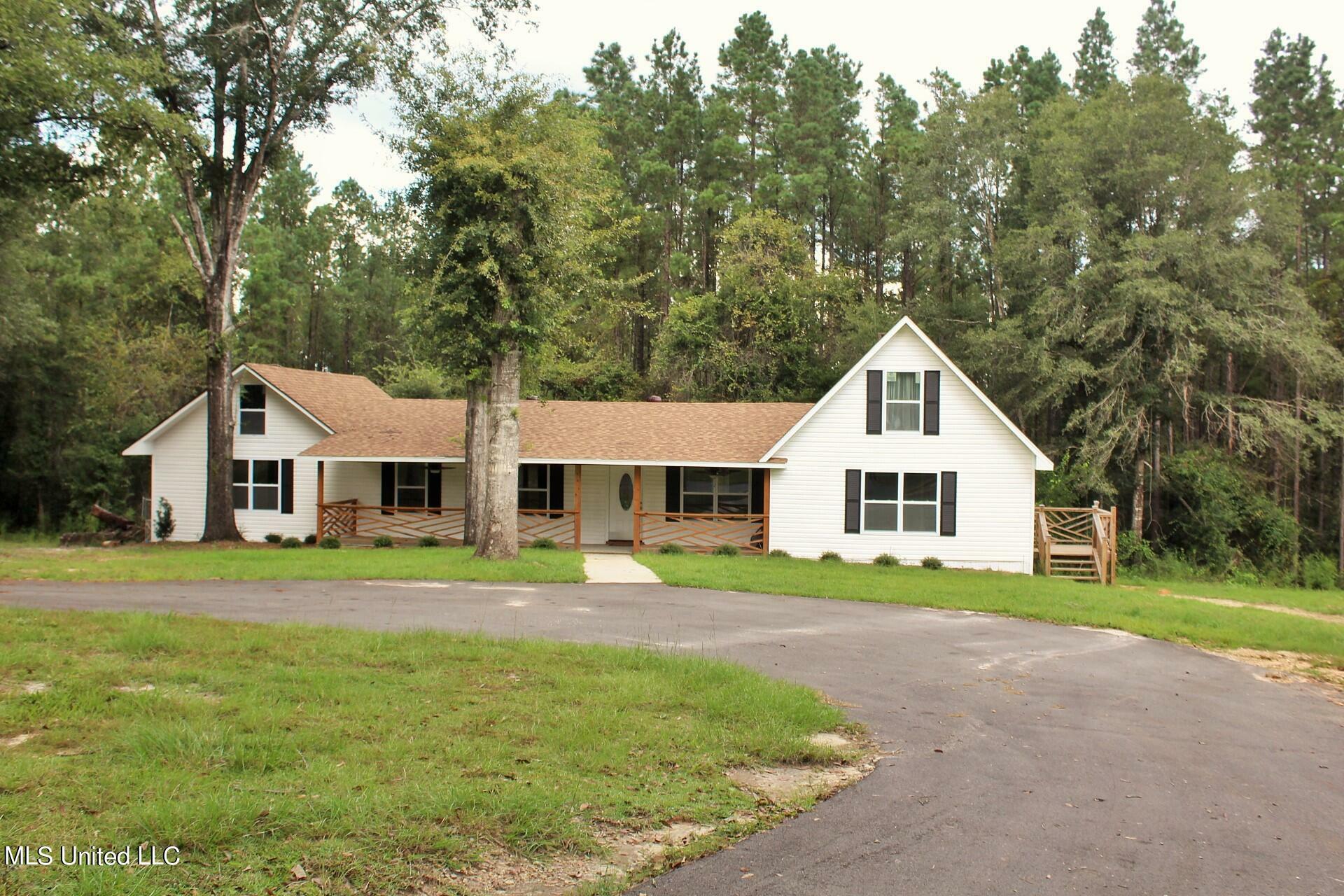 Property Photo:  122 J W Holland  MS 39452 