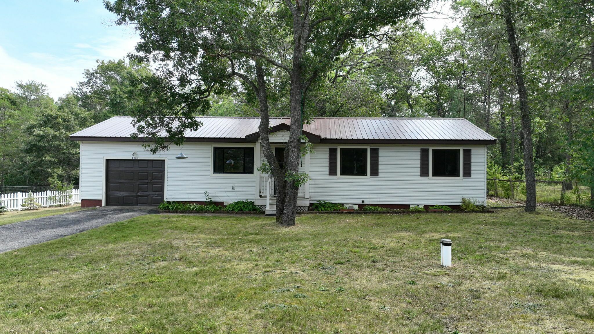 Property Photo:  7215 Tuscarora Circle  MI 49749 