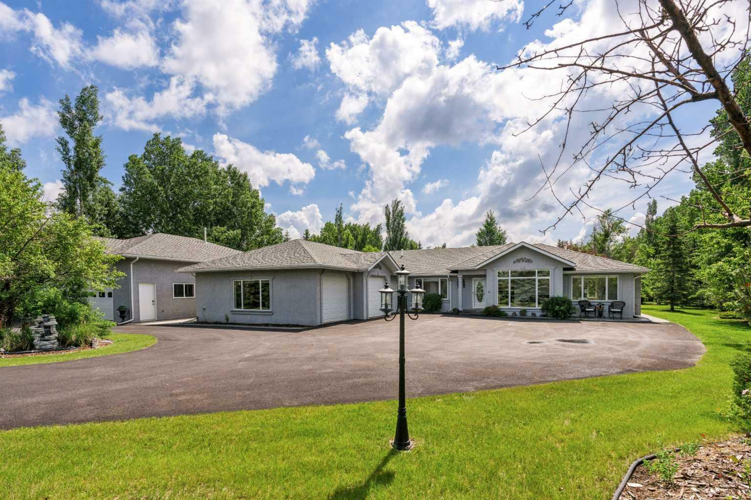 Property Photo:  4 Silvertip Drive  AB T1V 1Z1 