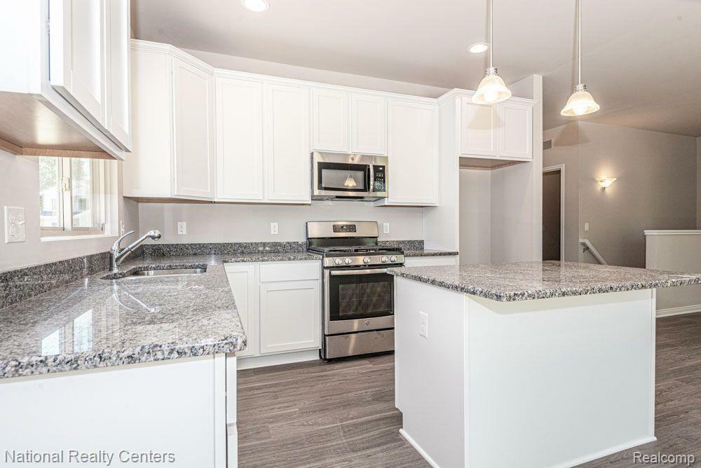 Property Photo: 303 Devonshire Drive MI 48446 4798