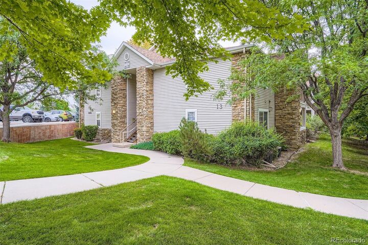 Property Photo:  7656 Depew Street 1802  CO 80003 