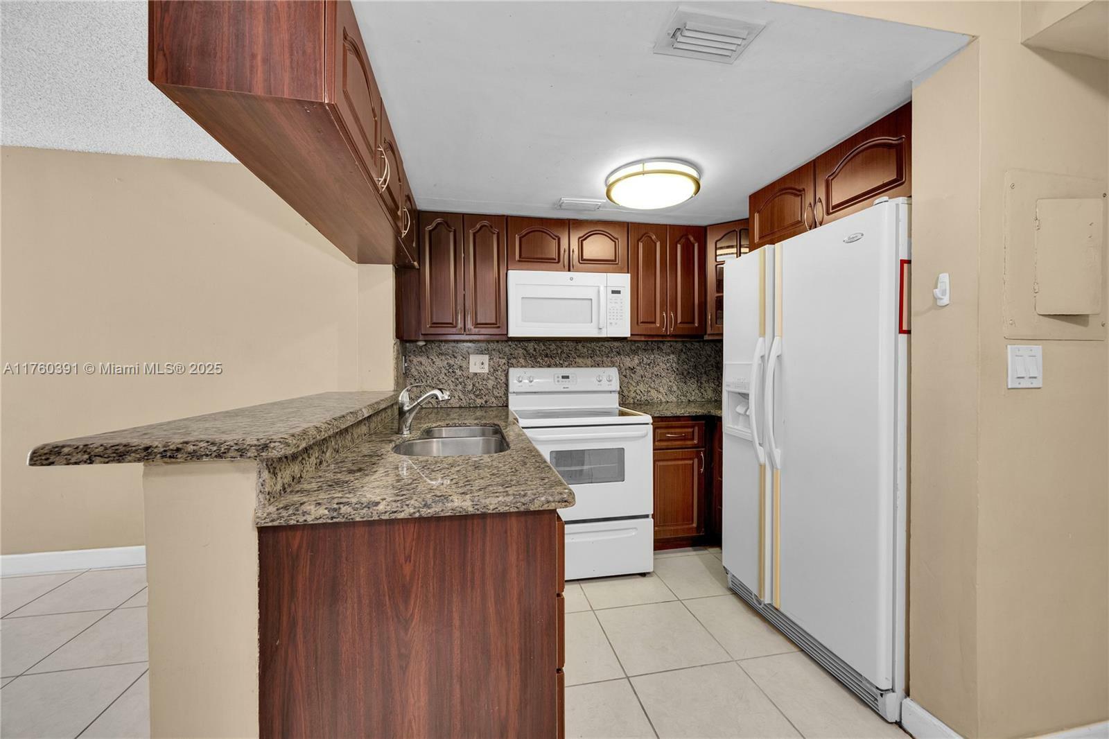 Property Photo:  8585 NW 6th Ln 9-208  FL 33126 