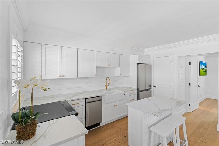 Property Photo:  980 7th Avenue S 107  FL 34102 