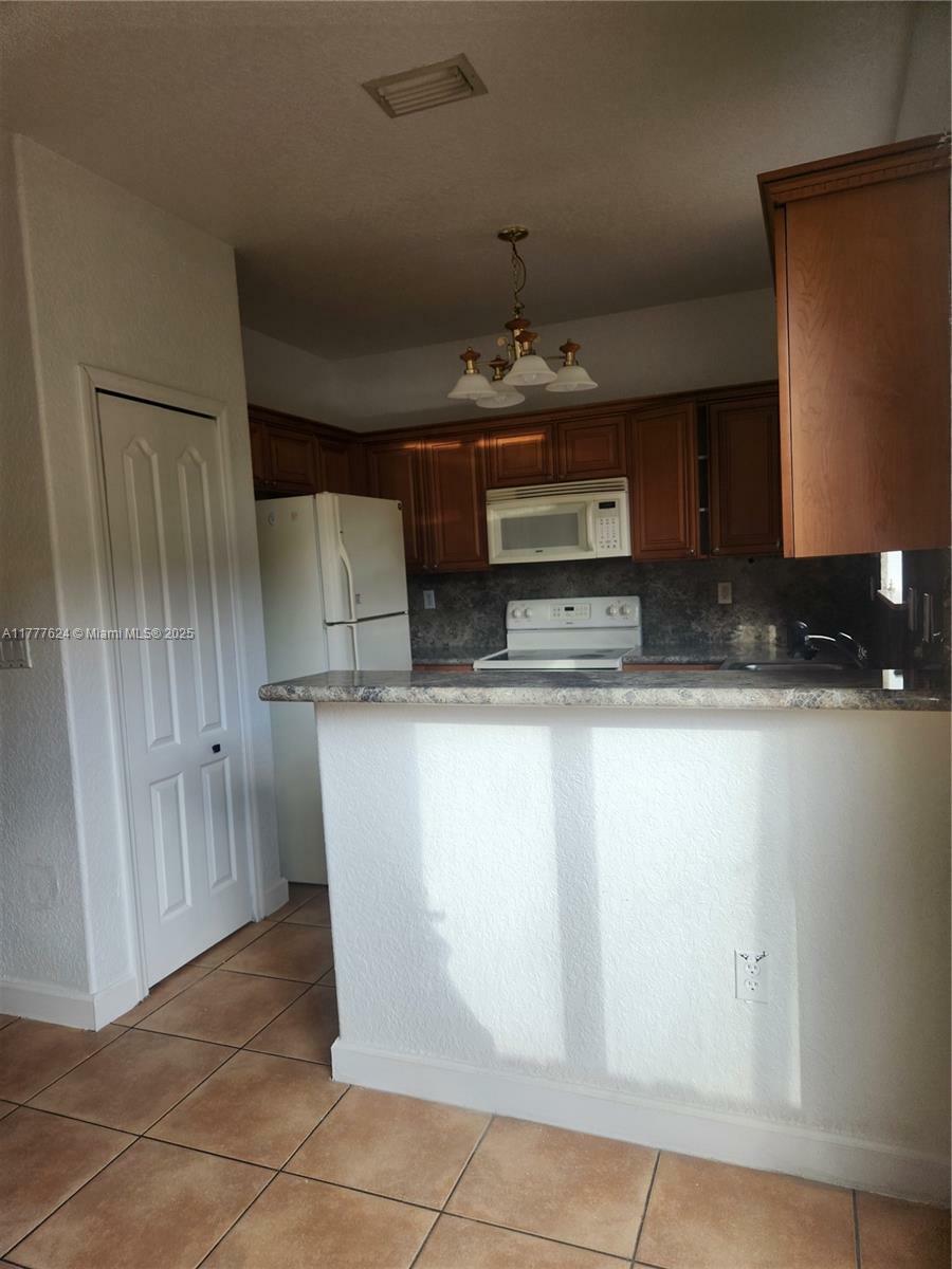Property Photo: 6940 NW 177th St P102 FL 33015