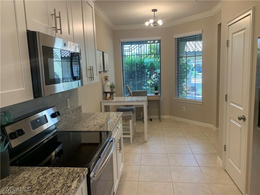 Property Photo: 9433 Benvenuto Court 5-101 FL 34119