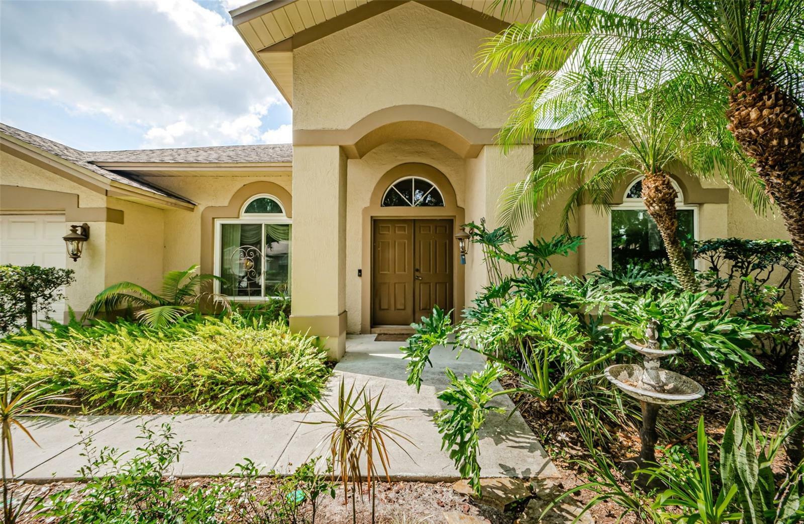 Property Photo: 9229 Dayflower Drive FL 33647