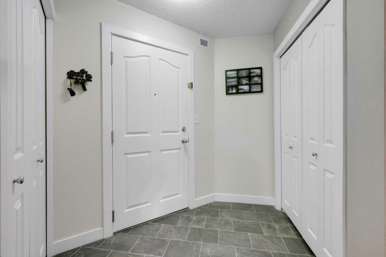 Property Photo: 403 Mackenzie Way SW 2106 AB T4B 3V7