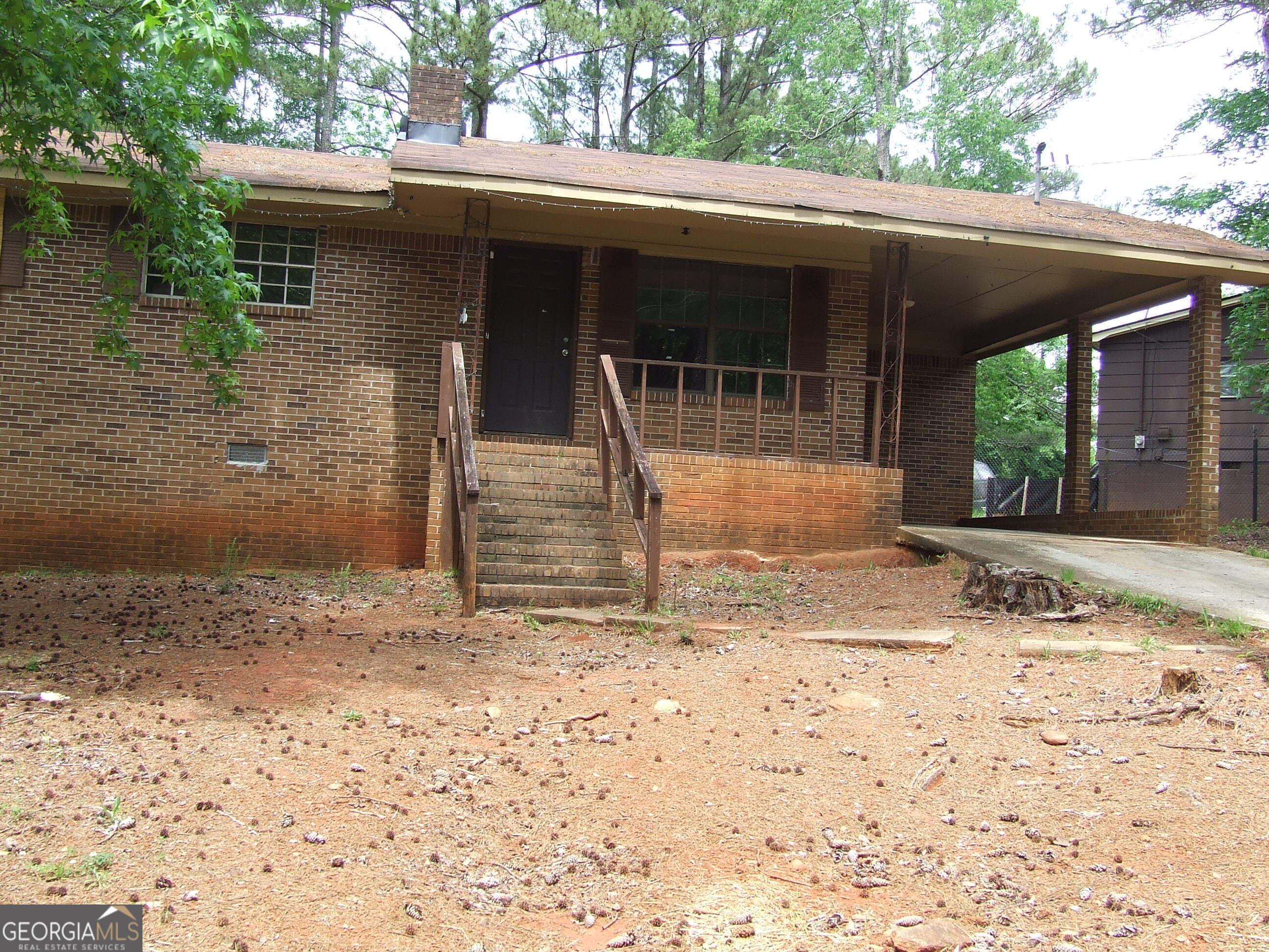 Property Photo:  7225 Pineneedle Drive SW  GA 30014 