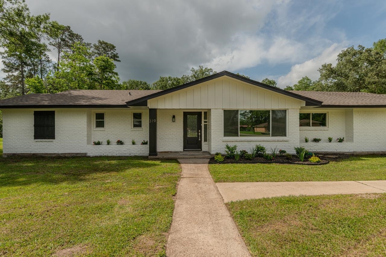 Property Photo:  319 Pinemont Dr  TX 77659 