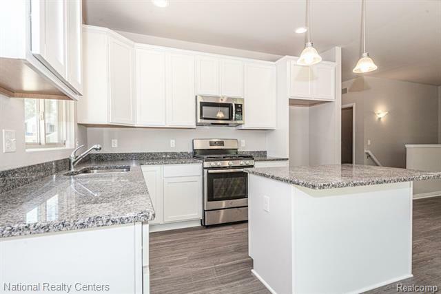 Property Photo: 305 Devonshire Drive MI 48446
