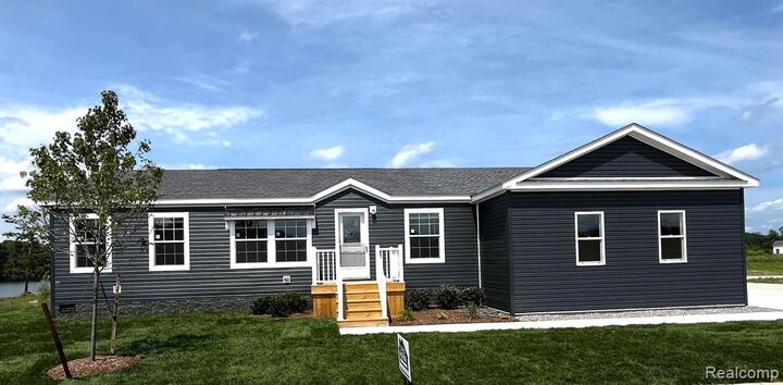 Property Photo:  202 Riviera Drive  MI 48446 