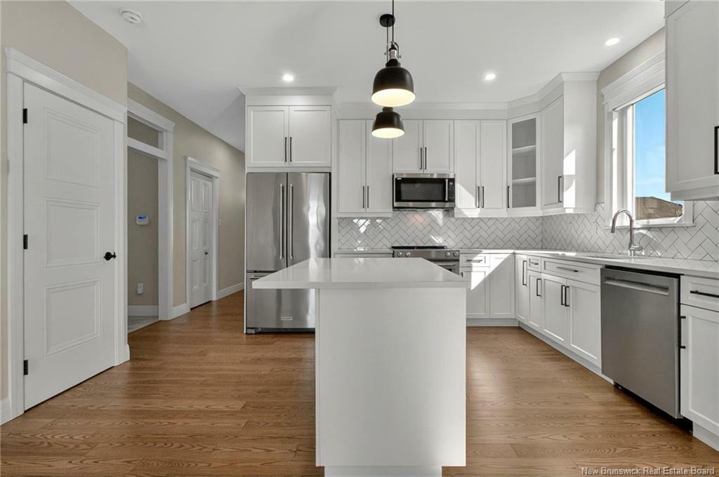 Property Photo: 673 Royal Oaks Boulevard NB E1H 0G2