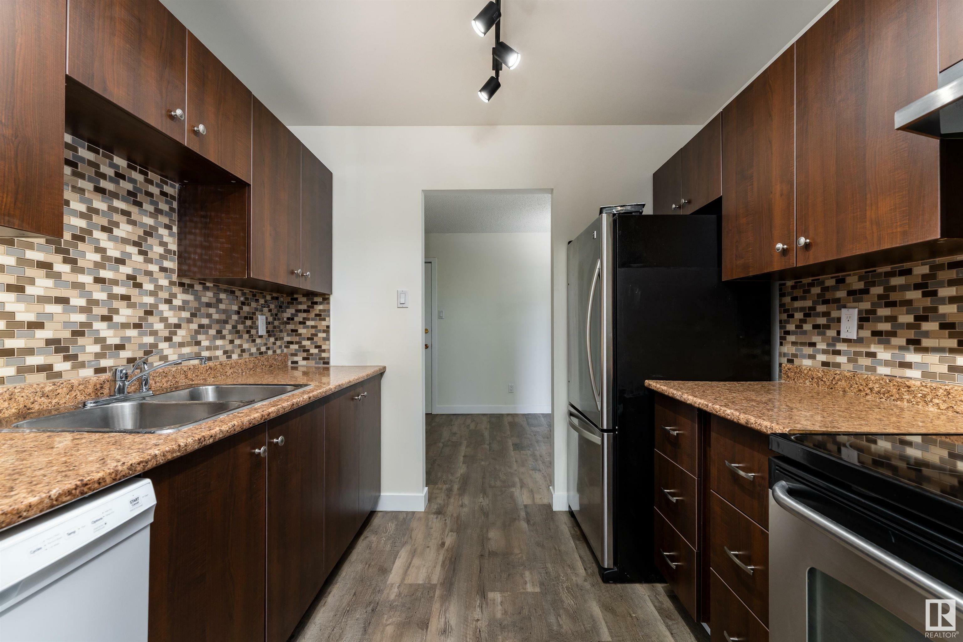 Property Photo: 5125 Riverbend Road NW 304 AB T6H 5K5
