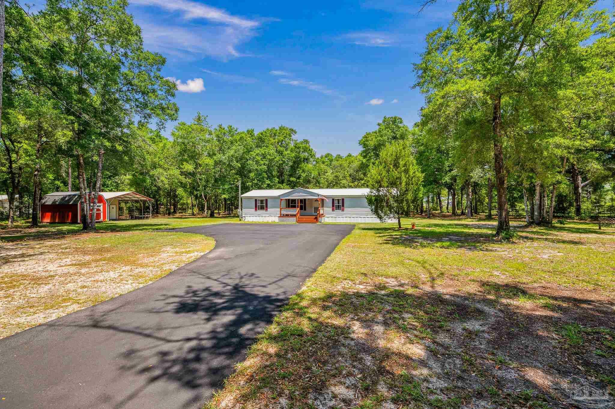 Property Photo:  8944 John Hamm Rd  FL 32583 