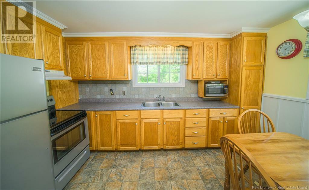 Property Photo: 205 Riverside Drive NB E5L 1W1