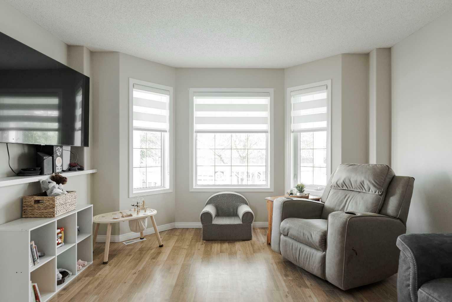 Property Photo: 208 Diefenbaker Drive AB T9K 2J9