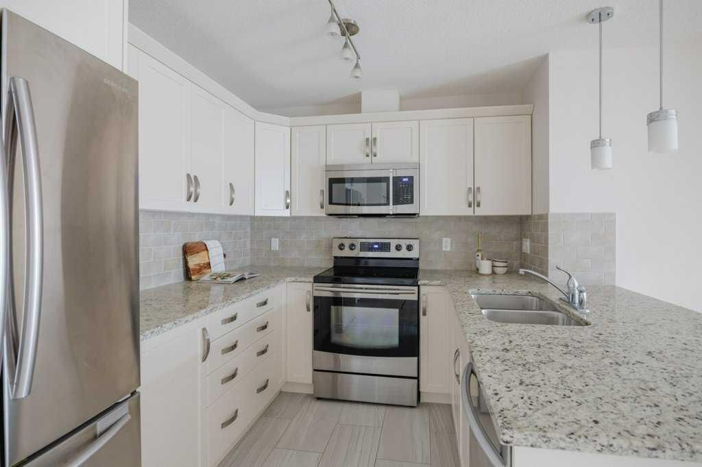 Property Photo: 115 Prestwick Villas SE 3305 AB T2Z 0M7