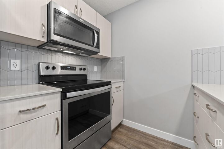 Property Photo: 1506 Tamarack Boulevard NW 310 AB T6T 2J5