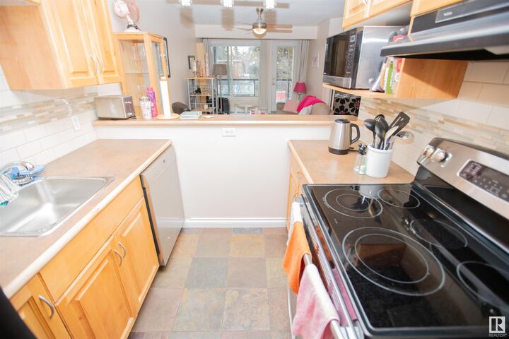Property Photo:  11033 127 Street NW 213  AB T5M 0T3 