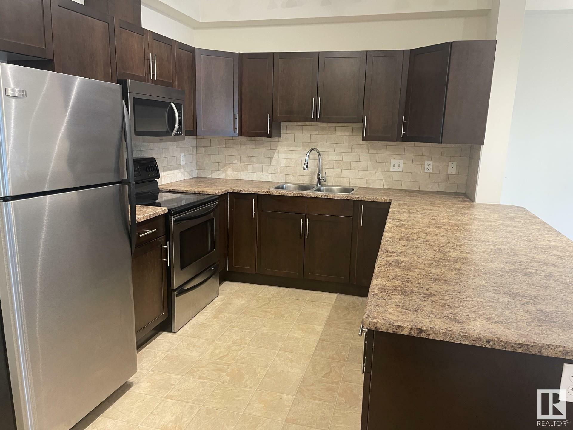 Property Photo: 2035 Grantham Cournt NW 105 AB T5T 3X4