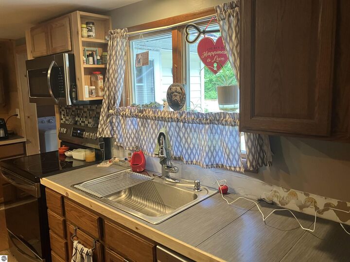 Property Photo:  5611 NE East Shore Drive  MI 49646