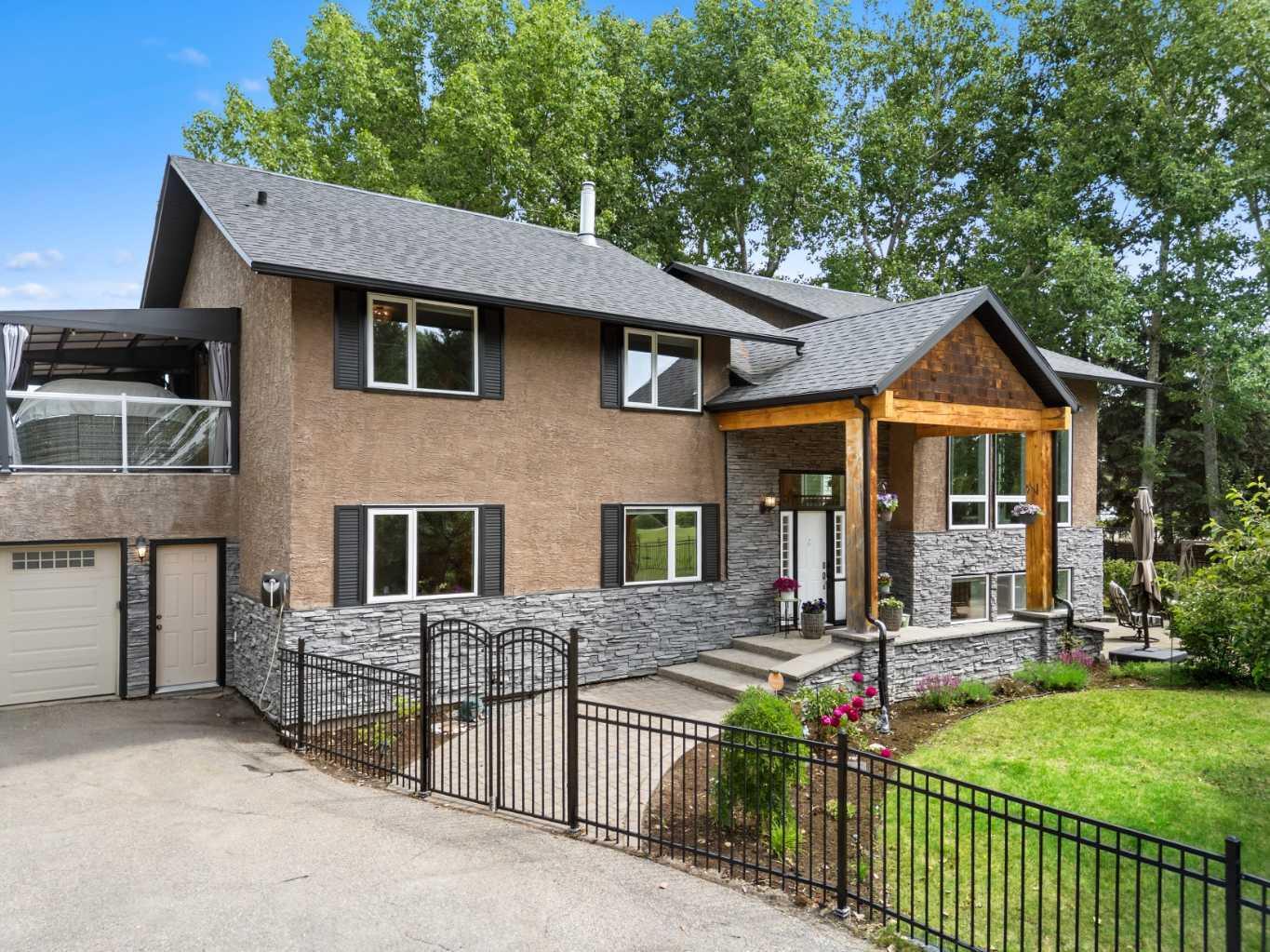 Property Photo: 502 Bearspaw Village Ridge AB T3L 3P1